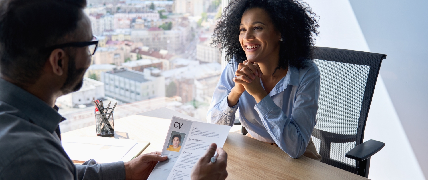 Friendly interview between indian hr manager and African American applicant.